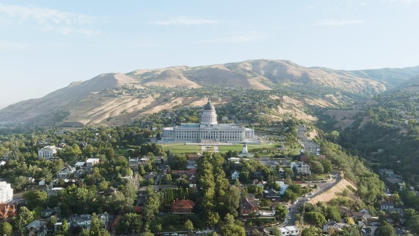 Aerial shot pushing towards the Utah State Capitol building.