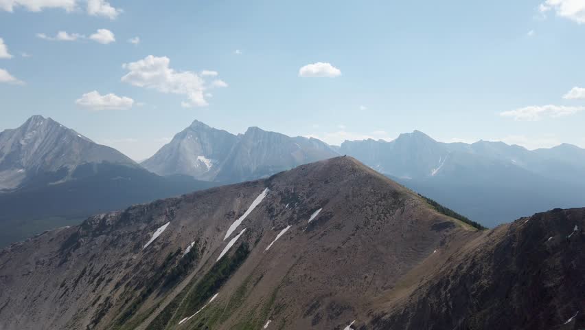 Mountain peak in distance with cabin on top, Rockies, Kananaskis, Alberta Canada