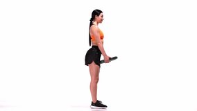 Young sportive girl training with sports equipment, weights over white studio background. Doing bends. Modern sport, action, motion, youth concept. Fitness, hobby, healthy lifestyle