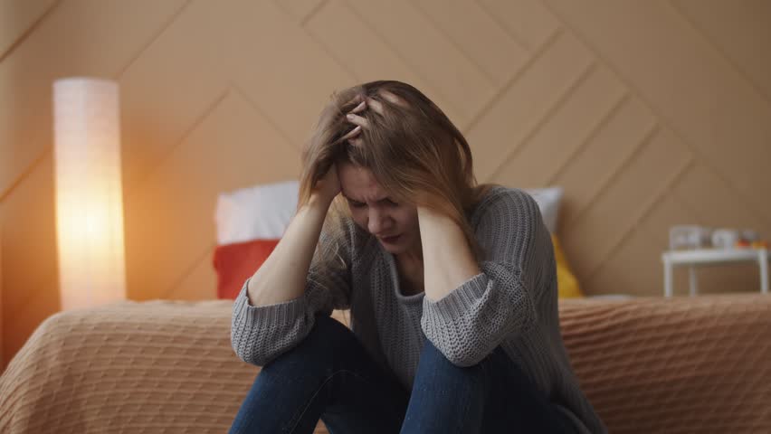 Depressed worried young caucasian woman in trouble feeling upset frustrated anxious thinking of psychological problem suffer from anxiety concept at home alone. Royalty-Free Stock Footage #1098451049