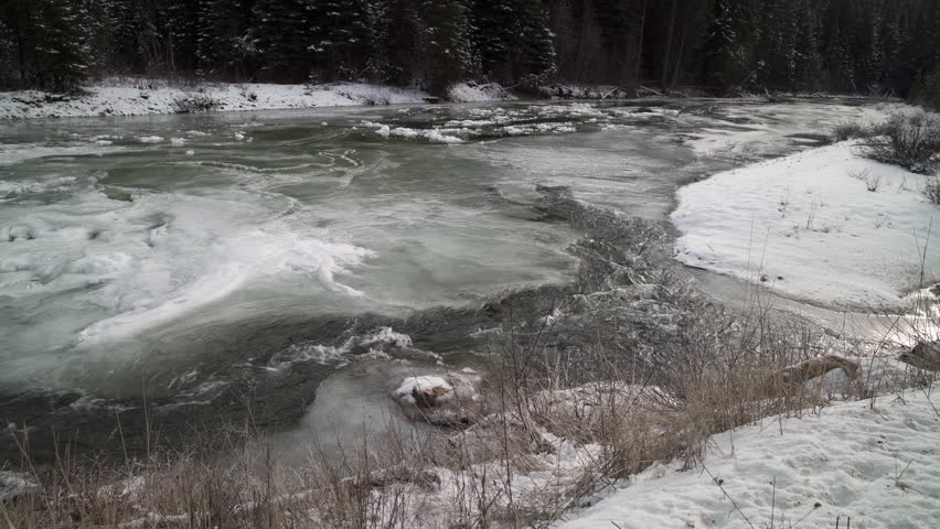 Winter River Rapids and Ice 4K UHD. The Skagit River running through Manning Park in the Cascade Mountains in winter. 4K UHD.
