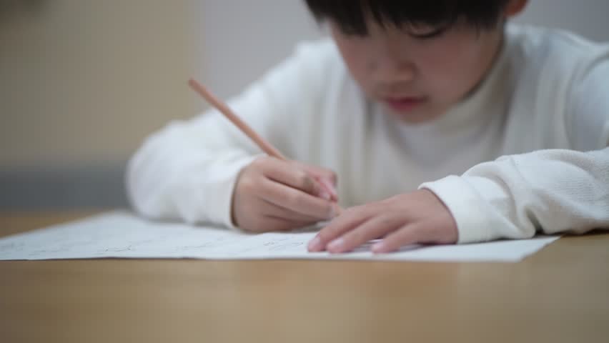 boy studying in the living room
