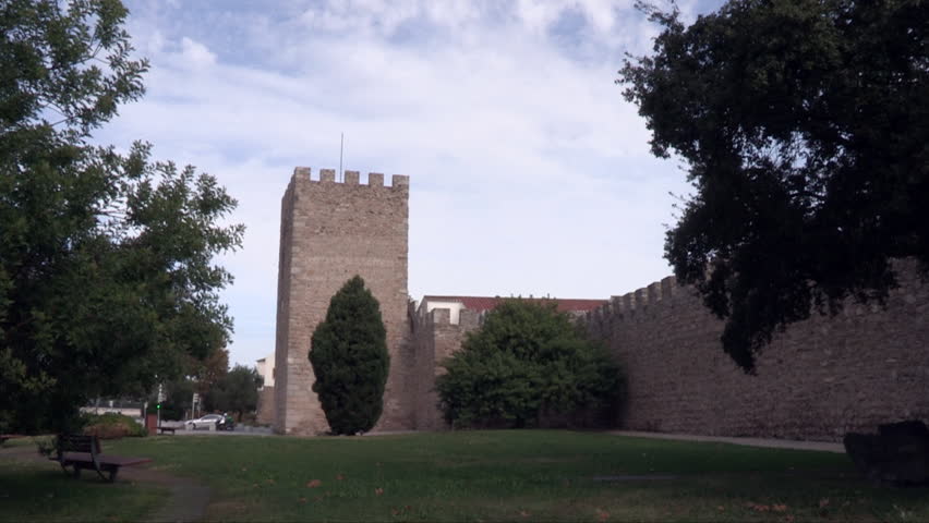 Walls of the city of Évora, with trees around it