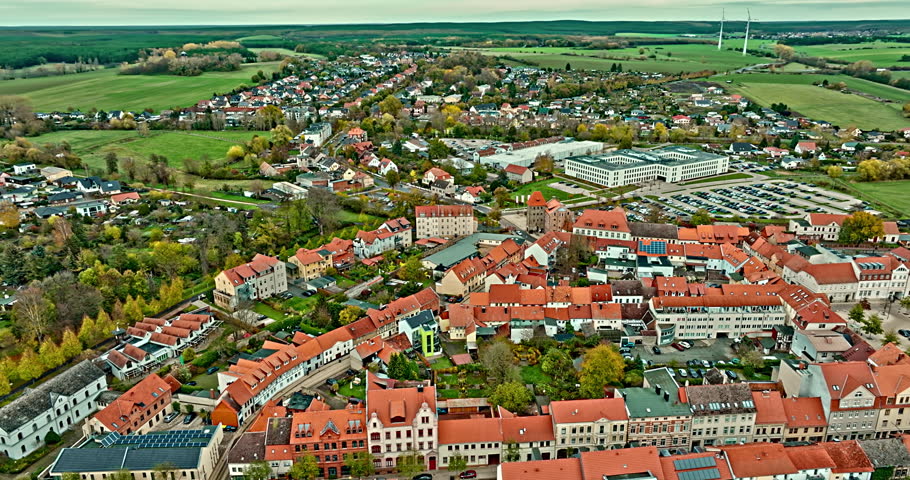 Aerial View of Haldensleben town , Saxony-Anhalt, Germany . flying over houses and trees . Börde district