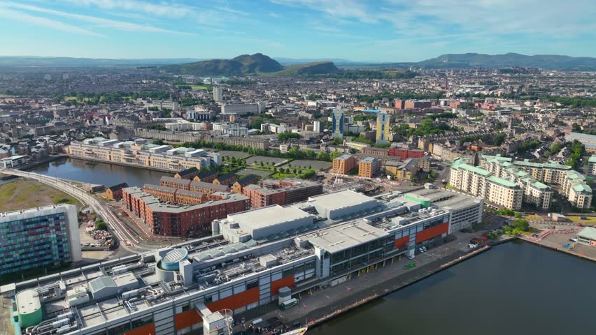 Leith historic town center aerial view including Ocean Terminal and Water of Leith, with Holyrood Park at the back, Leith in Edinburgh, Scotland, UK. 
