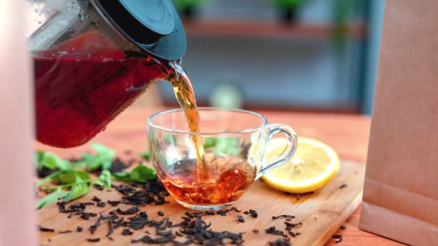 Black Tea - tea of the most usual type, that is fully fermented before drying. Royalty-Free Stock Footage #1098487775