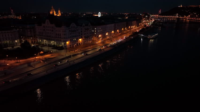 Establishing Aerial View Shot of Budapest City Skyline at night, urban traffic. Hungary