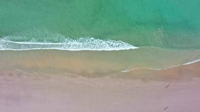 
aerial top view Wave after wave swept towards the shore. 
Landscapes view of beach turquoise sea sand and wave in summer day. 
Beach sea space area. Blue sea, waves crashing at Kata Beach Phuket Thai