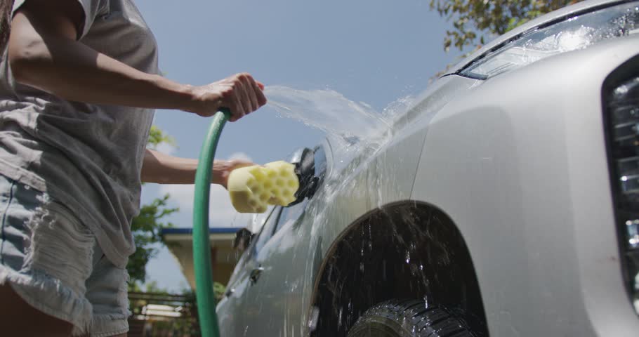 Women washing cars at home  Royalty-Free Stock Footage #1098505993
