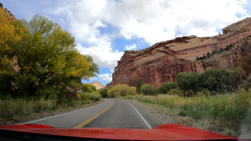 Driving through Capitol Reef National Park on a sunny day.