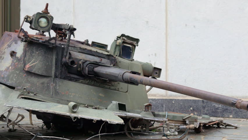 War in Ukraine. Destroyed tank with torn off turret. Broken and burned military tanks. Designation of a sign or symbol in white paint on the tank. Destroyed military equipment. War against Ukraine.