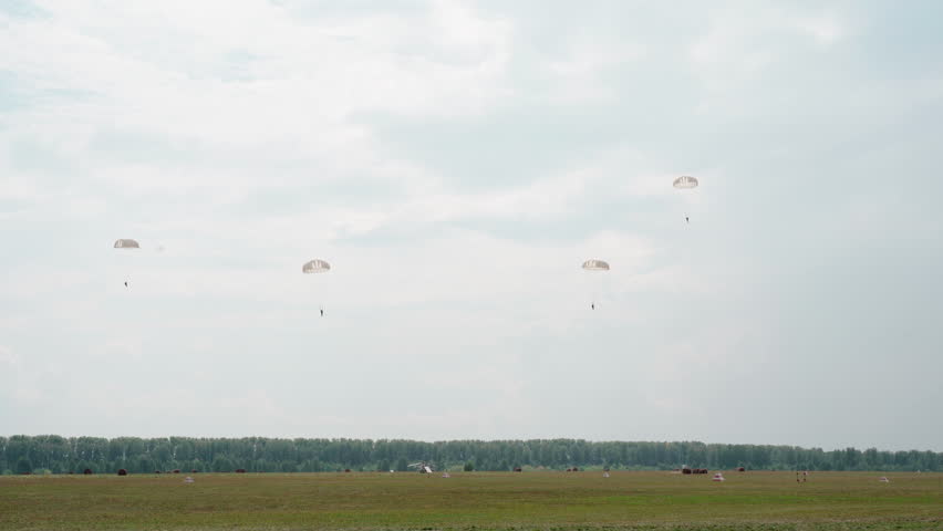 Armed fly paratroopers jump rounde parachute battlefield. Skydivers slow landing. Military parachutists soft get down ground. Jumpers paratrooper descent fall. Sky flight airborne troop. War air force