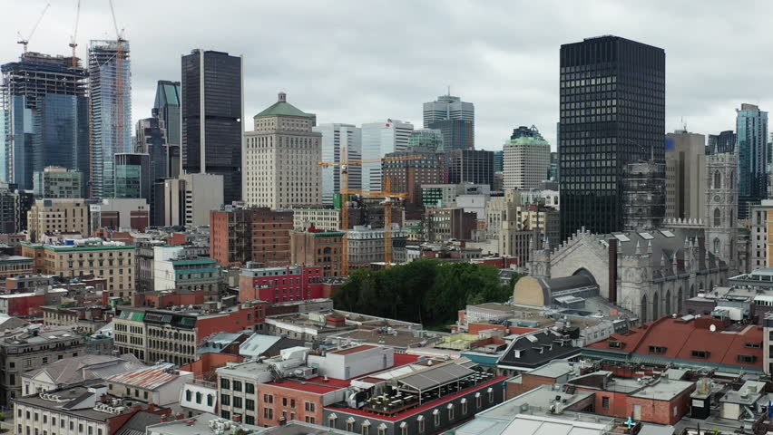 Aerial pan up of the Montreal, Quebec, Canada skyline 4K