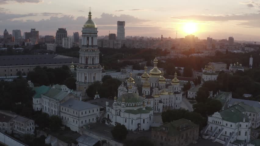 The Kiev Pechersk Lavra. Ukraine. Drone video. Great Lavra Bell Tower of the ancient cave monastery of Kievo-Pecherskaya Lavra with cityscape. Orthodox Monastery. Summer. 