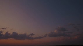A sunset sky with a blue and golden gradient and colorful solar rays. A romantic skyscape panorama with sunlight beams during the sunrise. An aerial view of heaven with an orange glow at dusk. - Powered by Shutterstock - Get 15% off with code: PIKWIZARD15