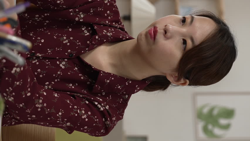 Vertical Screen: tired asian student feel eye strain fatigue after long time computer work. sickness women suffer from pain in dry irritated eyes and bad blurry vision eyesight problem. | Shutterstock HD Video #1098536551