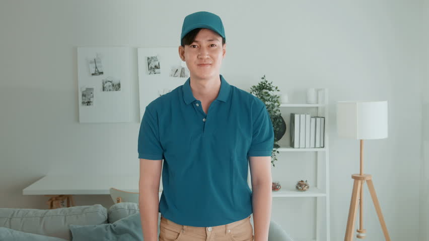 An Asian young Technician service man wearing blue uniform checking electrical appliances in home | Shutterstock HD Video #1098538185