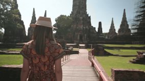 Young Asian women tourist traveling at Wat Chaiwatthanaram, ancient buddhist temple, famous and major tourist attraction religious of Ayutthaya Historical Park, Thailand, This temple is public places