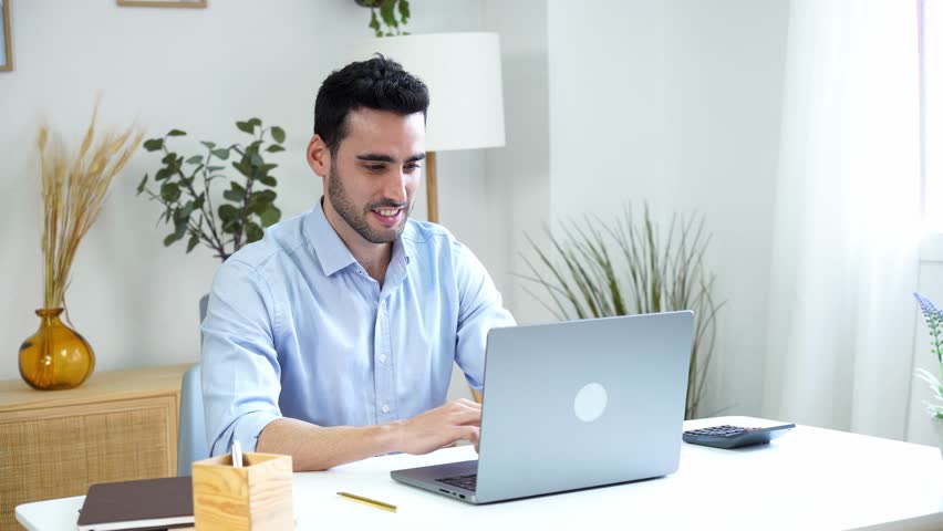 Happy man working on laptop in home office | Shutterstock HD Video #1098548347