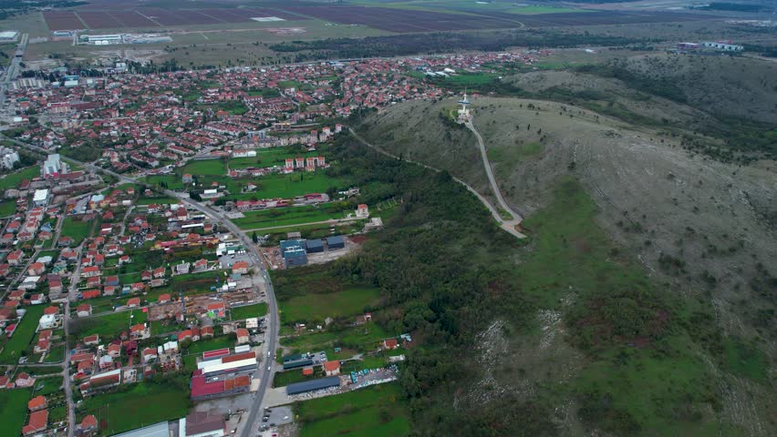 Aerial view around the city Podgorica in Montenegro on a cloudy afternoon in autumn.	
