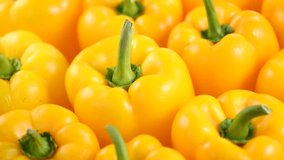 Yellow peppers close up, rotating background. Vegan vegetable sweet organic bell pepper backdrop. Fresh sweet organic bell pepper close up.  - Powered by Shutterstock - Get 15% off with code: PIKWIZARD15