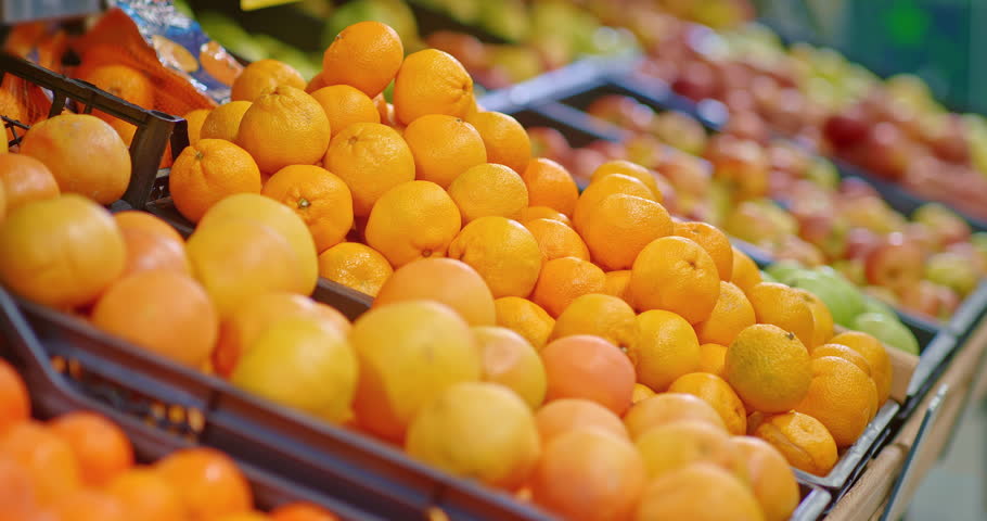 box with tangerines in supermarket, buying fresh organic fruits in food market, 4K, Prores