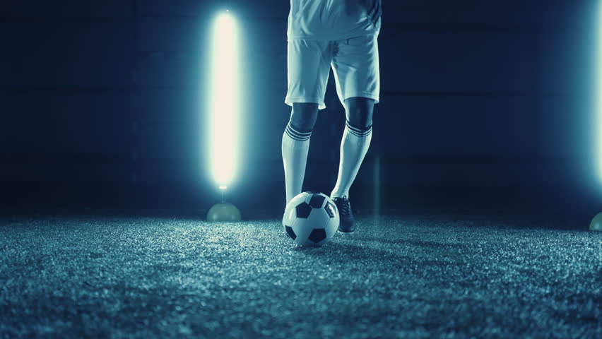 Talented junior football player training alone in night, closeup view of legs, freestyle dribbling | Shutterstock HD Video #1098553869