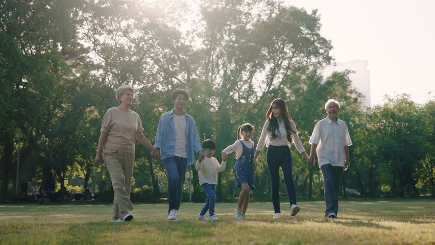 Happy Asian family walking in the park, Outdoor with big family and summer season concept Royalty-Free Stock Footage #1098555599