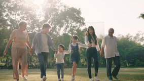 Happy Asian family walking in the park, Outdoor with big family and summer season concept - Powered by Shutterstock - Get 15% off with code: PIKWIZARD15
