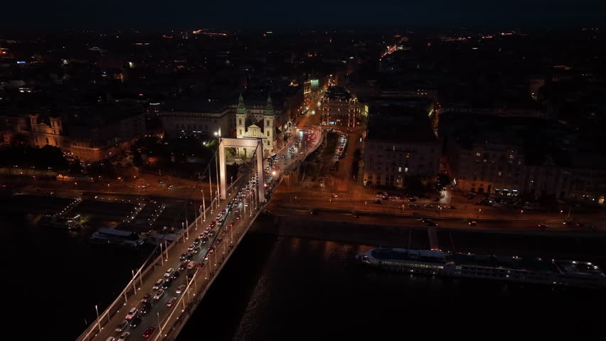 Aerial night view of Budapest Elisabeth Bridge, the third newest bridge of Budapest, Hungary, connecting Buda and Pest across the River Danube | Shutterstock HD Video #1098559237