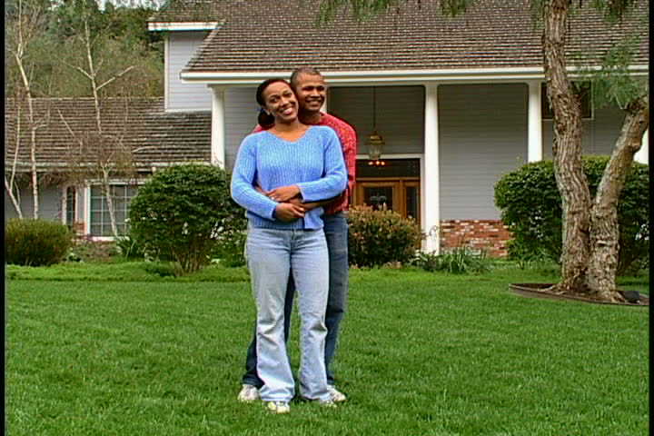 Couple in Front of House