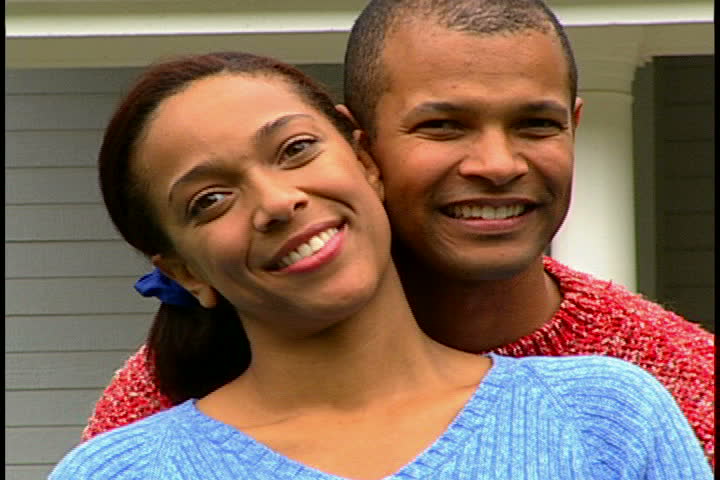 Couple in Front of House