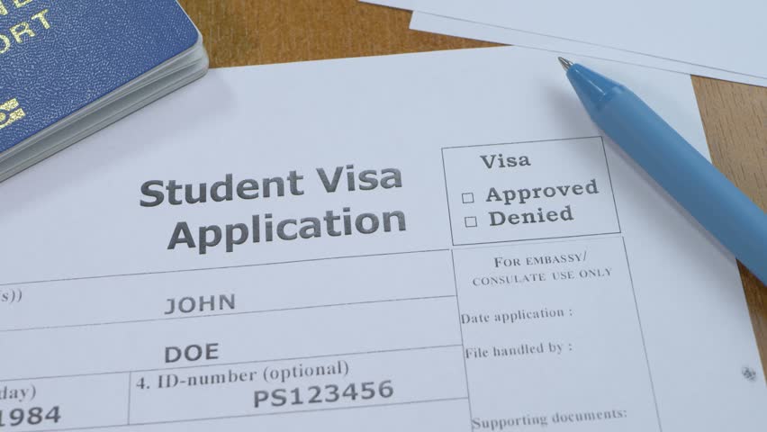 Approval student visa stamp and travelling passport ID. Apply and permission for foreigner country. Border agent on checkpoint. Legal system to get permit. Border officer check person's information Royalty-Free Stock Footage #1098569001