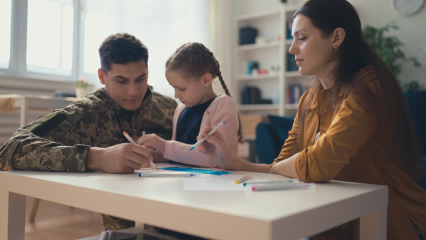 Military family drawing at home, enjoying time together, reunion, hobby