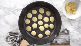 Time lapse. Flat lay. Step by step. Frying mini pancake cereal in a nonstick frying pan.