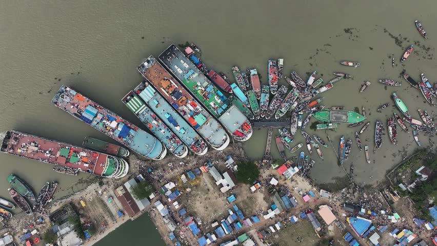 Aerial view of people along the port waiting for passengers boats at the Third largest Muslims congregation in Barisal, Bangladesh.