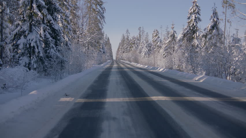 Back view driving plate, car driving on an empty forest mountain road in winter, snow covered with trees, no other cars. Show with a chase car | Shutterstock HD Video #1098583569