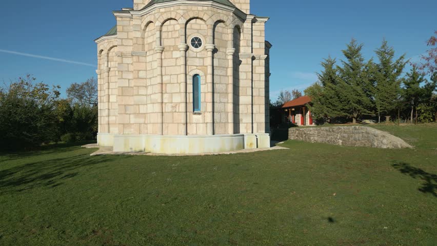 Aerial view around a Chapel in Montenegro on a sunny day in fall	