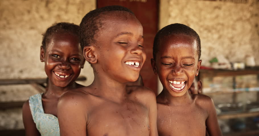 A Group Of African Children, Laughing, Jumping and Playing in Rural Area. Little Faces Full Of Joy and Life After Having Fun Playing with Water and Getting Refreshed in Summer Hot Weather Royalty-Free Stock Footage #1098588525