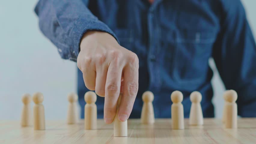 Businessman hand choose people standing out from the crowd, Ideas for choosing leaders for business success organization development leadership personnel selection