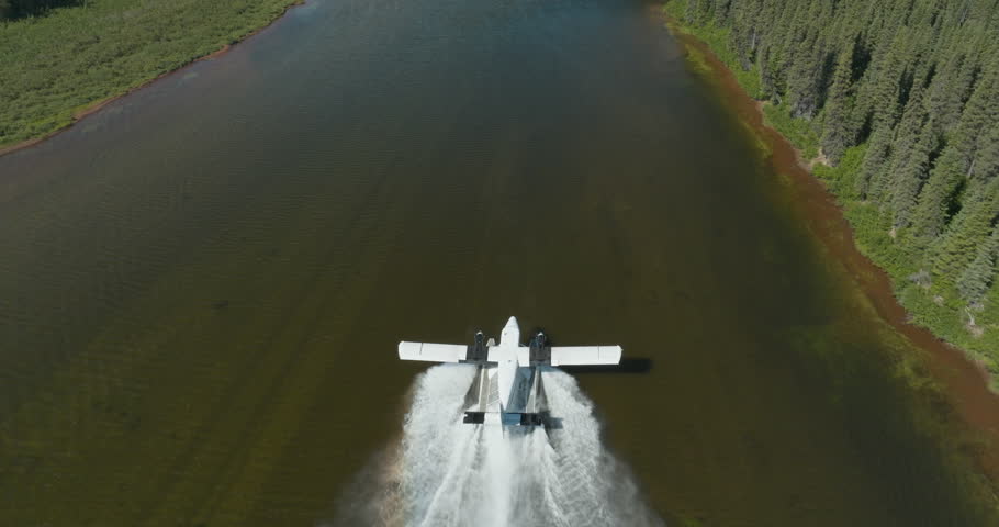 Breathtaking aerial view of a seaplane taking off from the Flowers River in Labrador, Canada
