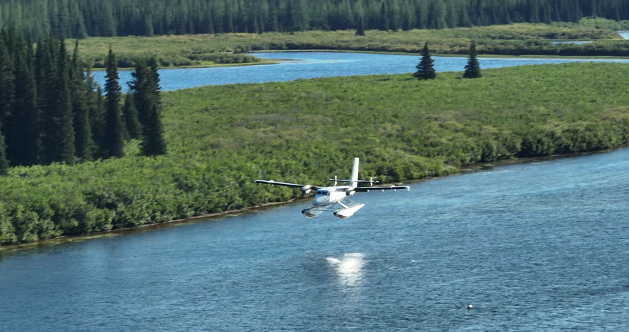Incredible tracking shot following a seaplane landing on a river in Labrador, Canada