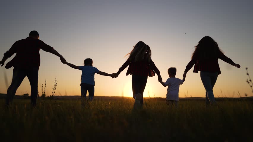 People in park silhouette. Happy family holding hands together in nature. Happy children with father walk. Family running together in park holding hands. Father playing with children outdoors Royalty-Free Stock Footage #1098596991