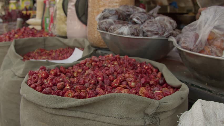 A closeup of a shopkeeper selling dried red chili at a street market in Rawalpindi Pakistan