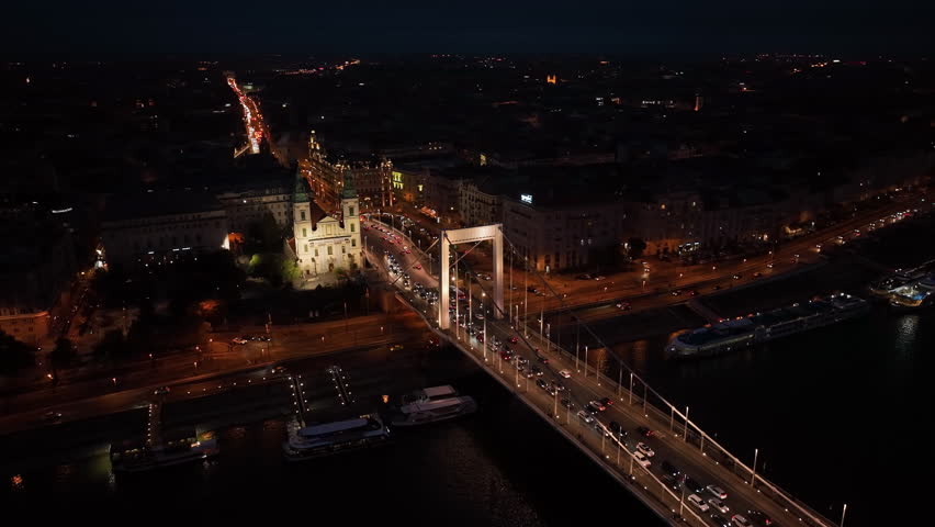 Aerial night view of Budapest Elisabeth Bridge, the third newest bridge of Budapest, Hungary, connecting Buda and Pest across the River Danube | Shutterstock HD Video #1098601909