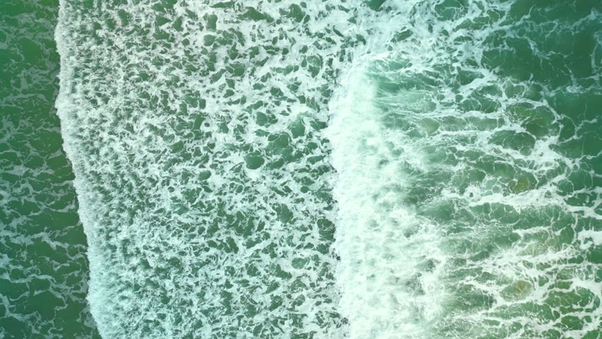 Beautiful texture of big power dark ocean waves with white wash. Aerial top view footage of fabulous sea tide on a stormy day. Drone filming breaking surf with foam in Vietnam ocean. Big swell in Asia | Shutterstock HD Video #1098608381