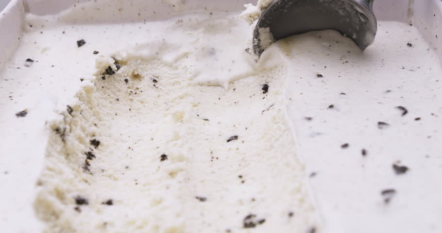 Close-up ice cream Cookies and Cream scooped out of container, Front view Food concept. | Shutterstock HD Video #1098614251