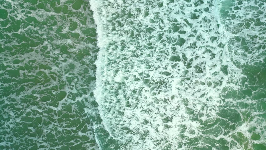 Beautiful texture of big power dark ocean waves with white wash. Aerial top view footage of fabulous sea tide on a stormy day. Drone filming breaking surf with foam in Vietnam ocean. Big swell in Asia | Shutterstock HD Video #1098626561