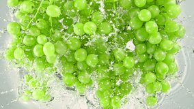 Super Slow Motion Shot of Fresh Green Grape Wine Falling into Water on White Background at 1000 fps. - Powered by Shutterstock - Get 15% off with code: PIKWIZARD15