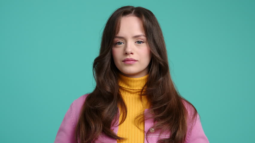 Portrait of cheerful female gardener feeling proud of her harvest. Close-up shot of a girl in colorful clothes holding fresh and tasty pomegranate. High quality 4k footage